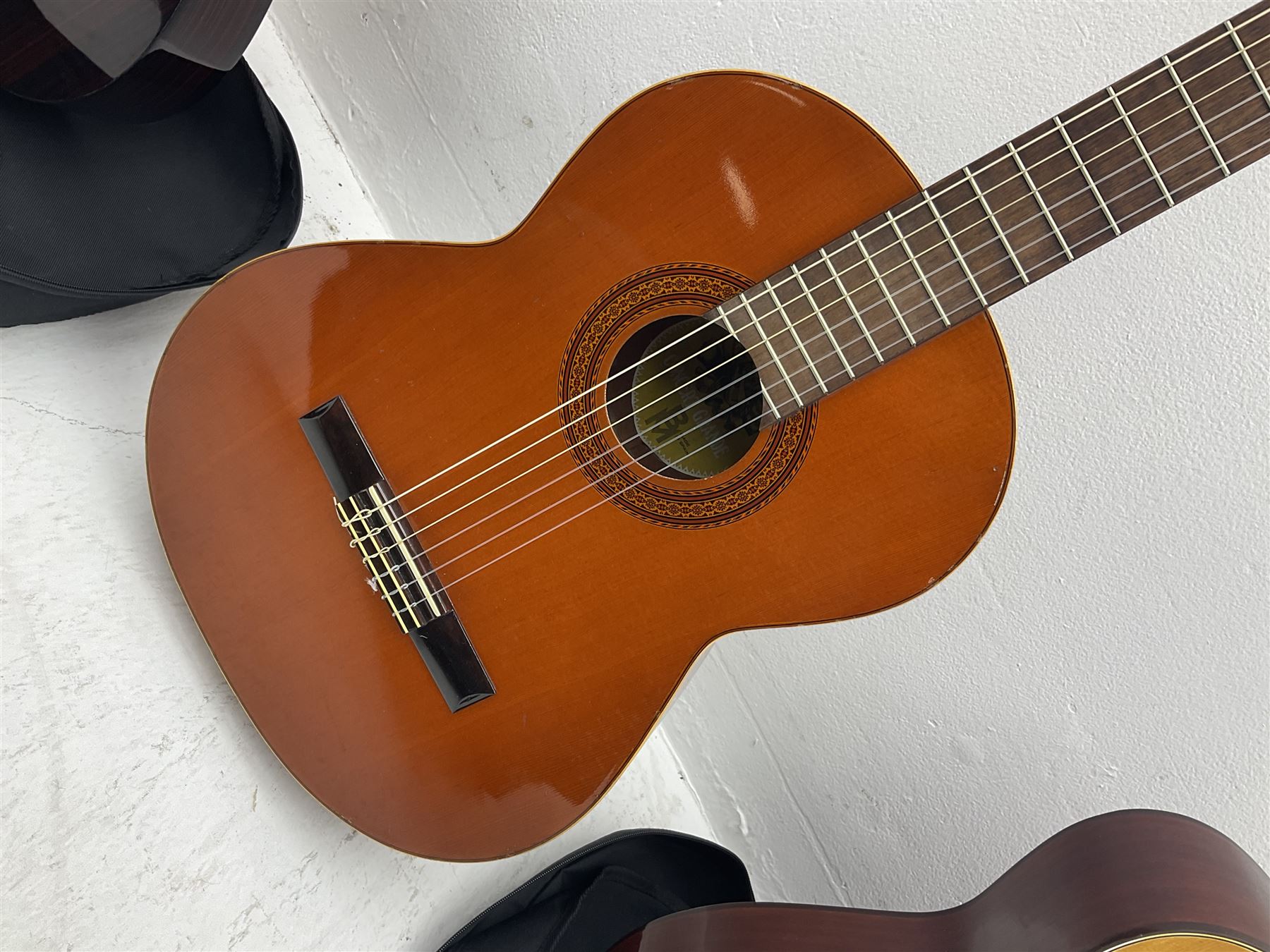 Saxon acoustic guitar Folk Model 812, serial no.43263 L102cm; Jose Ferrer El Primo small or child's size acoustic guitar, serial no.006980 L85cm; both in carrying soft cases; and Spanish Admira Concert Grande acoustic guitar (3)