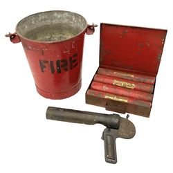 Antifyre Pistole fire extinguisher grenade launcher together with four cartridges (one lacking contents) in original storage tin, together with a red painted fire bucket