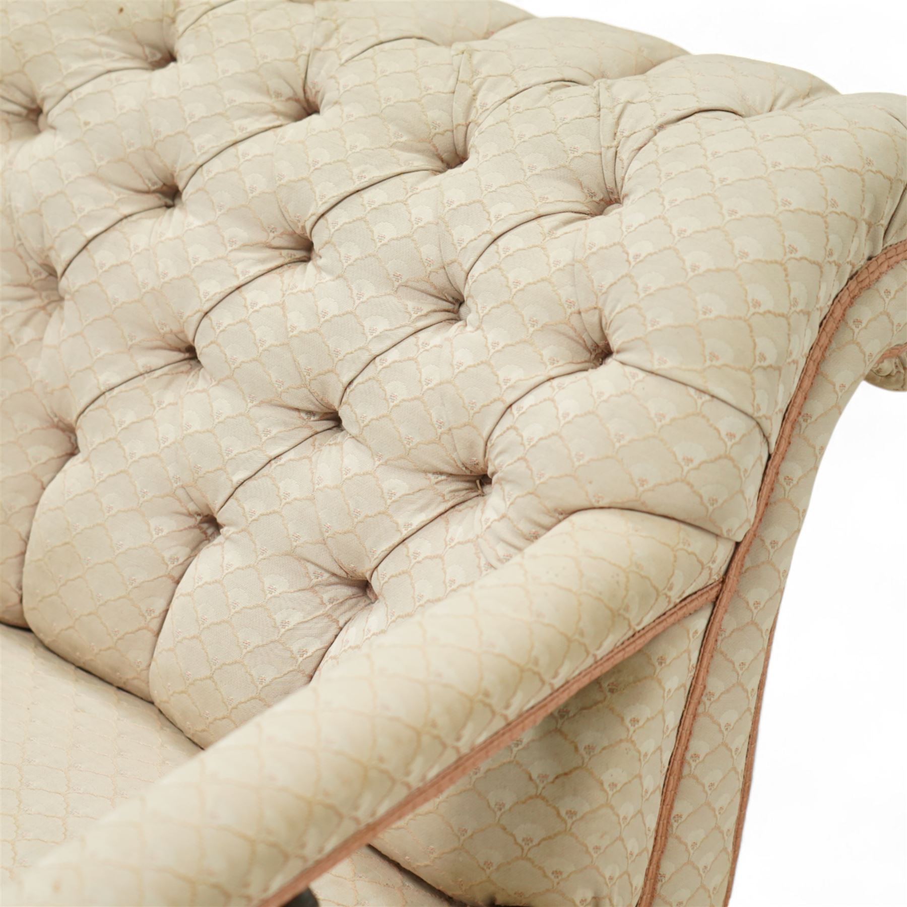 Late 19th century cream upholstered chaise longue, patterned pale damask fabric, padded arm with spindle back gallery raised on turned legs upon castors