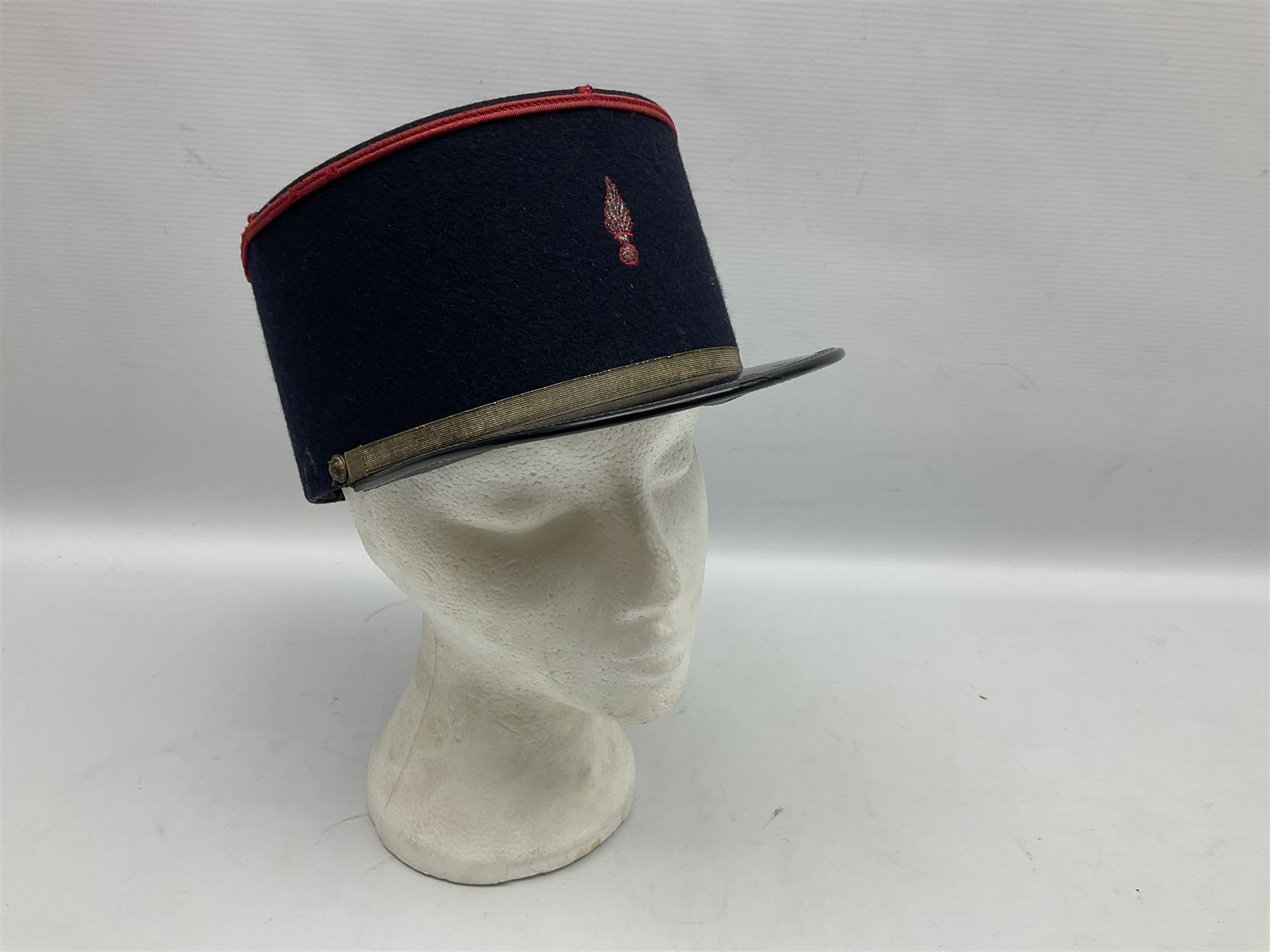 Mid 20th century French Ugeco Nantes first class dress navy blue uniform with ribbon bar with cap, and quantity of Sapeurs Pompiers patches, Sapeurs Pompiers de Caen belt buckle etc