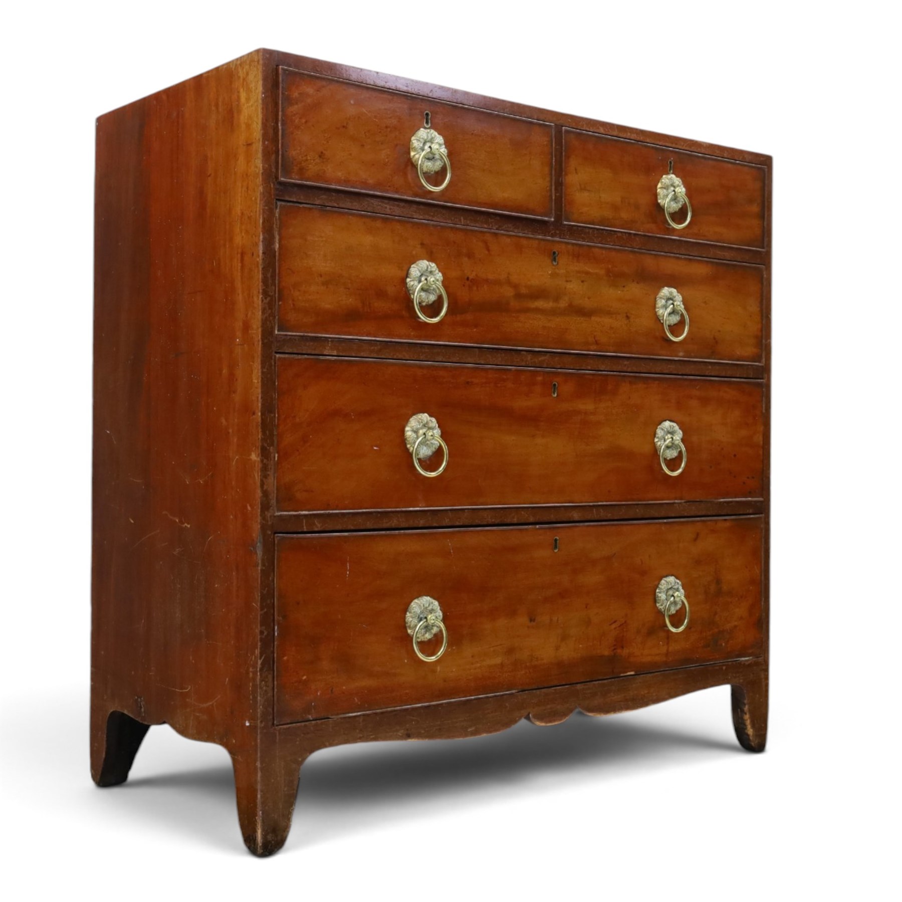 George III mahogany straight-front chest, two short over three long graduating drawers, cockbeaded edges with brass rose handles, raised on shaped supports