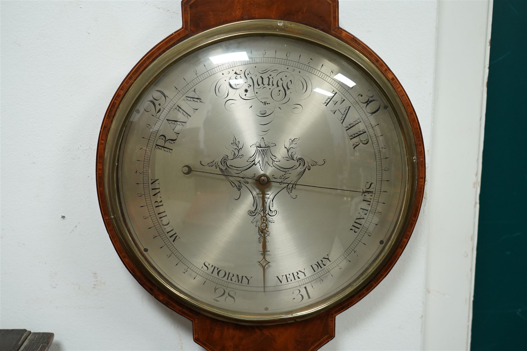Zanetti of Manchester- late 19th century wheel barometer in a mahogany case with a break arch pediment, brass finial and rounded base, with a hydrometer, spirit bubble and boxed spirit thermometer, 12