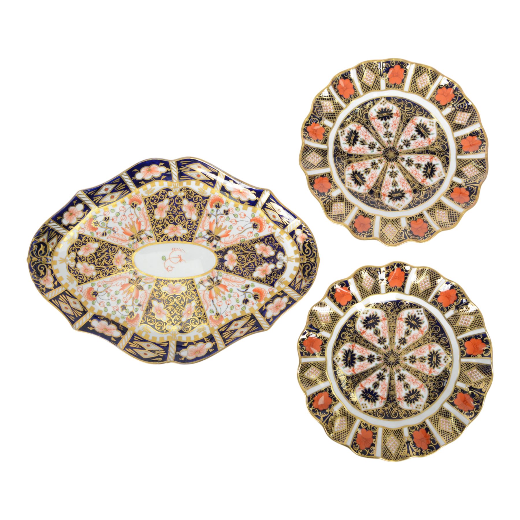 Royal Crown Derby Imari pattern 1128, two plates with fluted rim, together with Royal Crown Derby platter in pattern 6299, plates D22cm