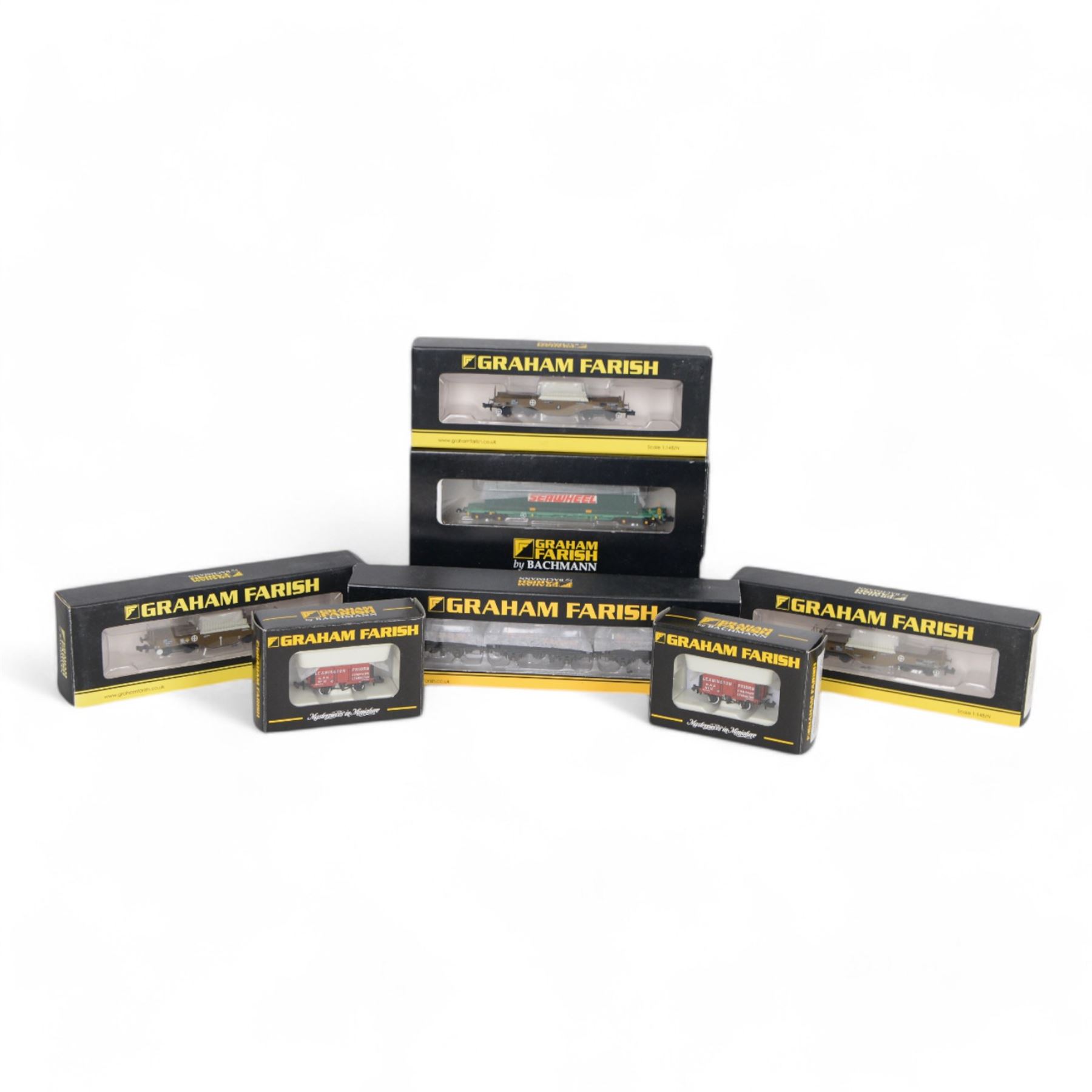Graham Farish 'N' gauge rolling stock, comprising 373-785 Set of TTA Tank Wagons Shell Black Weathered, two 377801 FNA Nuclear Flask Wagon Flat Floor 550023, 377802 FNA Nuclear Flask Wagon Sloping Floor 550038, two 377075Y 7 Plank Wagons Leamington Priors and 377350 International Bogie Wagon with 45 Containers 'Seawheel', all boxed 