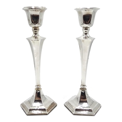 Matched pair of candlesticks one by James Deakin & Sons, Chester 1928 , the other makers mark S & Co, Birmingham 1925