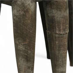 African Nupe carved tribal stool, the rounded top with repeating incised decoration and rope-edge border, supported by ten tapered legs D37cm
