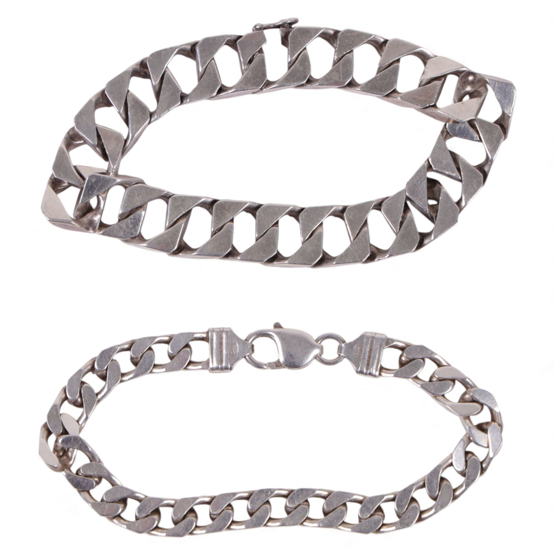 Two silver curb link bracelets, stamped or hallmarked 
