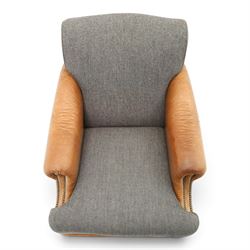Tetrad - 'Taransay' Harris Tweed and tan leather club armchair, Howard shape with reclined back over deep seat and rolled arms with studwork, raised on turned front supports with castors, the sides and arms upholstered in tan leather with seat and back in herringbone-stitched Harris Tweed