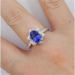18ct white gold tanzanite and diamond cluster ring, oval tanzanite, with baguette and round brilliant cut diamond surround and baguette cut diamond shoulders, stamped 750, tanzanite approx 1.80 carat, total diamond weight approx 0.55 carat