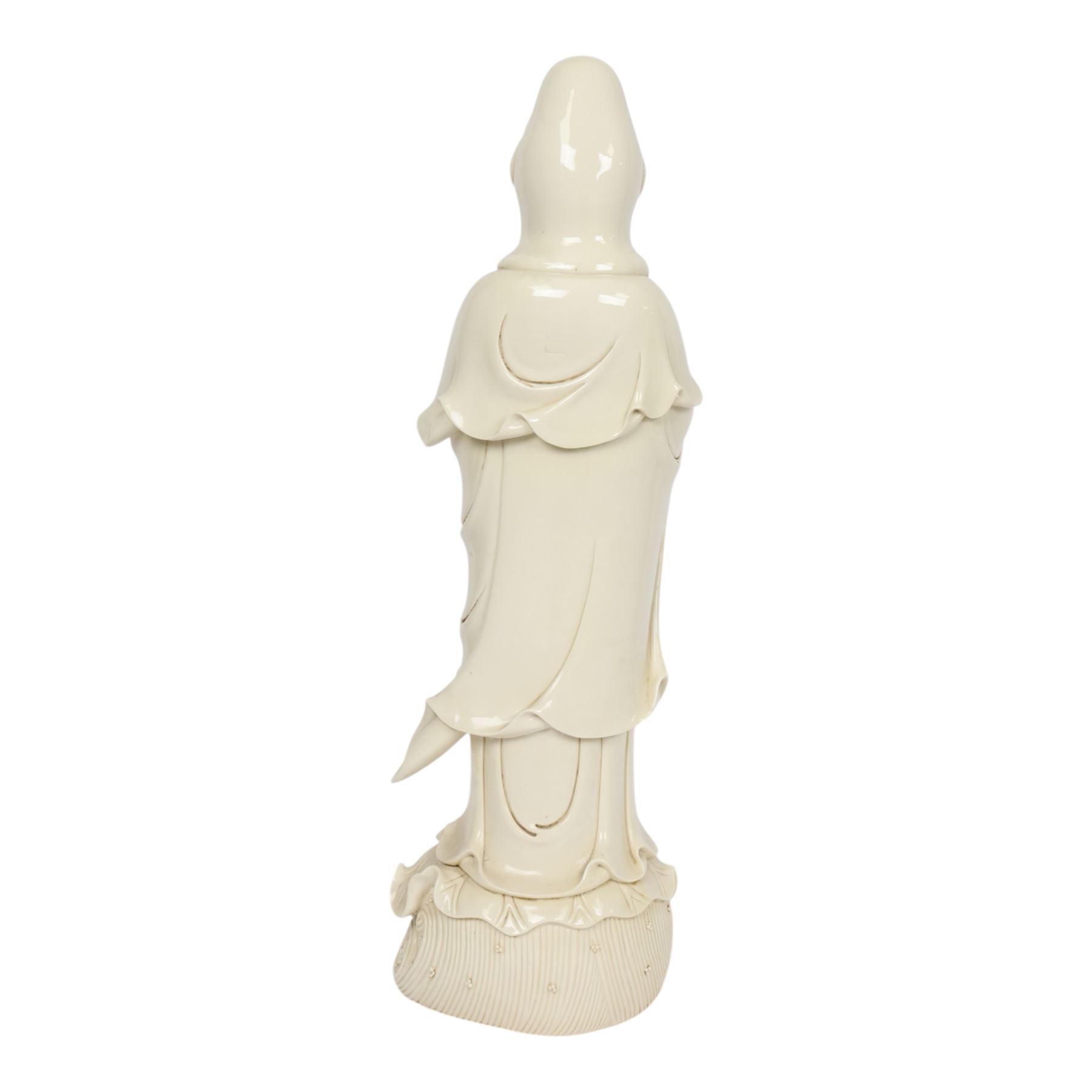 Large Chinese blanc de chine figure of Guanyin, depicting the goddess stood upon a lotus leaf with one hand raised, with potters seal mark to the reverse, H75cm