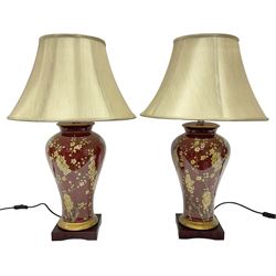 Pair of large table lamps of tapering form, decorated with Japanese blossom on a red ground, upon a square base, including shade H72cm