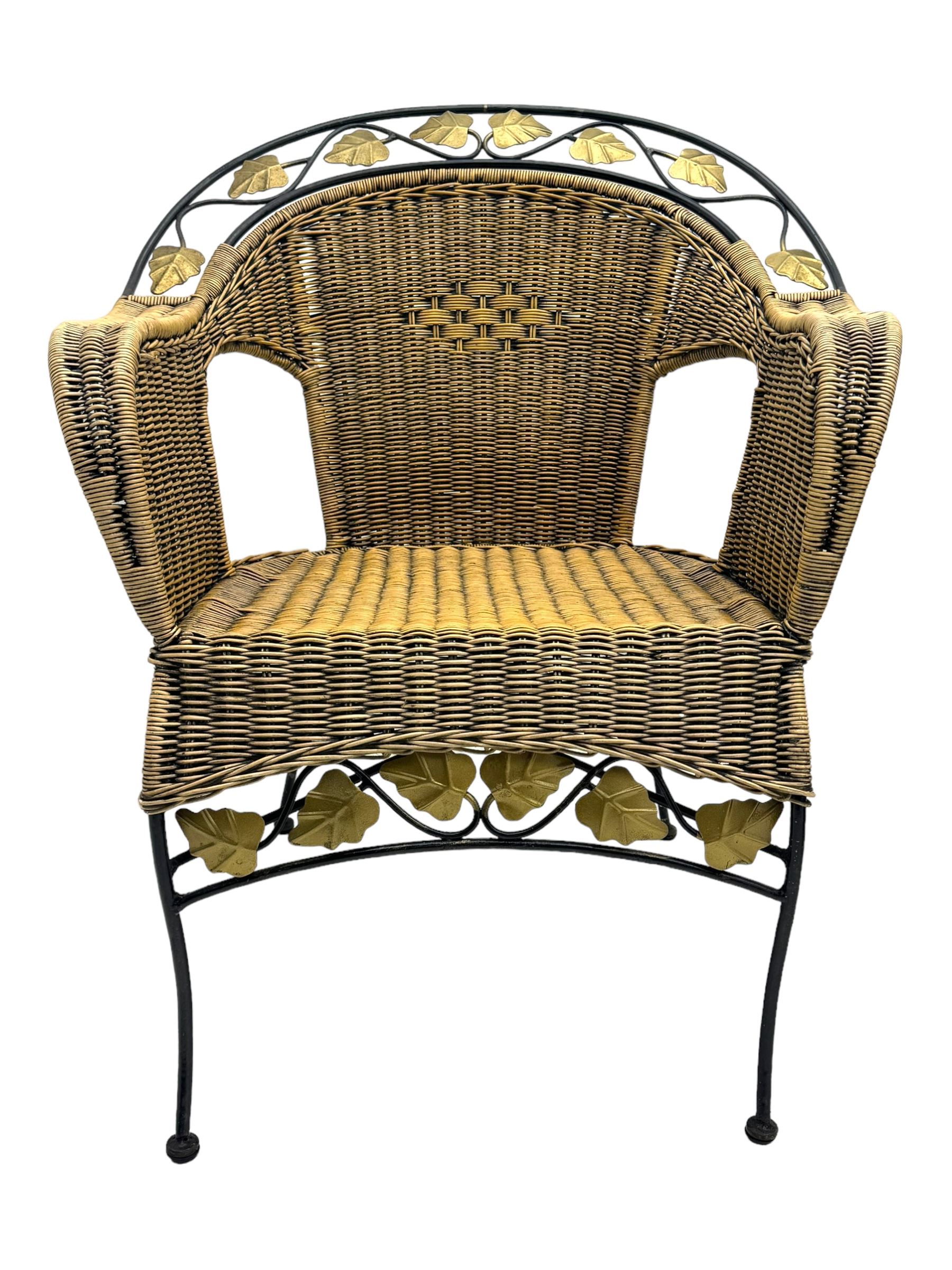 Late 20th century three-piece garden suite, wicker construction and wrought iron frame, decorated with cast metal leaf motifs, cream seat cushions and round back cushions