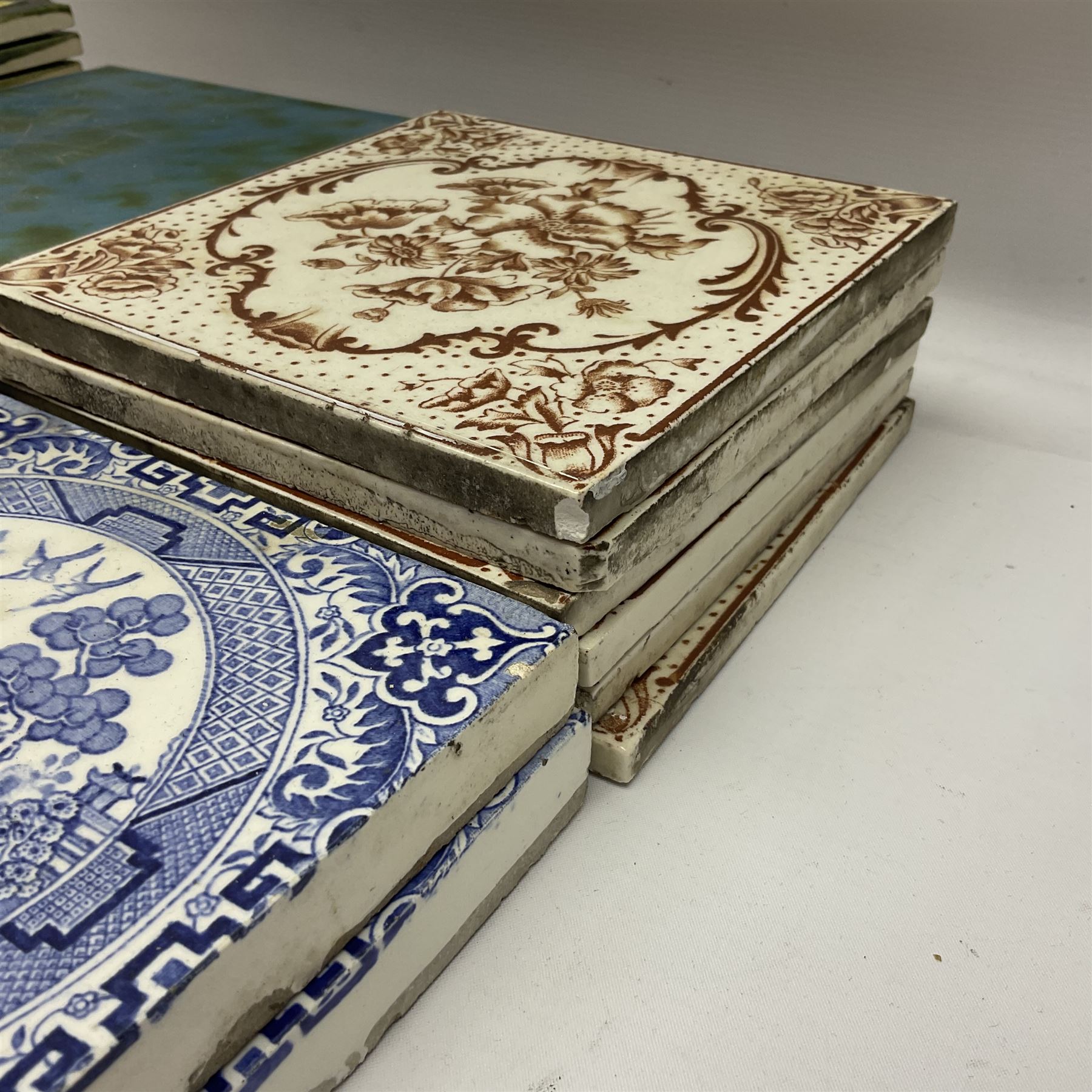 Collection of Victorian and later tiles to include floral and tube line examples