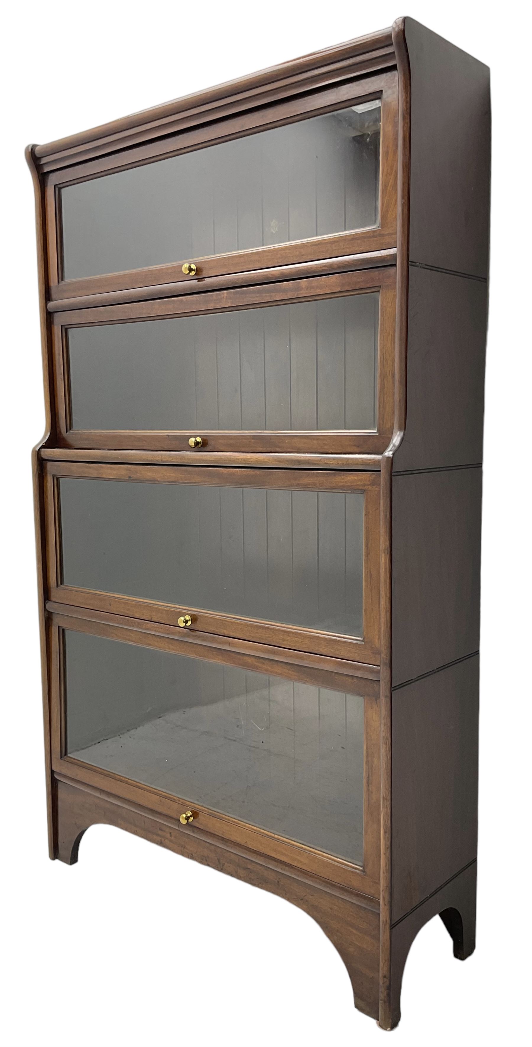 Kenric Efferson - early 20th century mahogany four-tier library bookcase, enclosed by four glazed up-and-over doors, on bracket feet