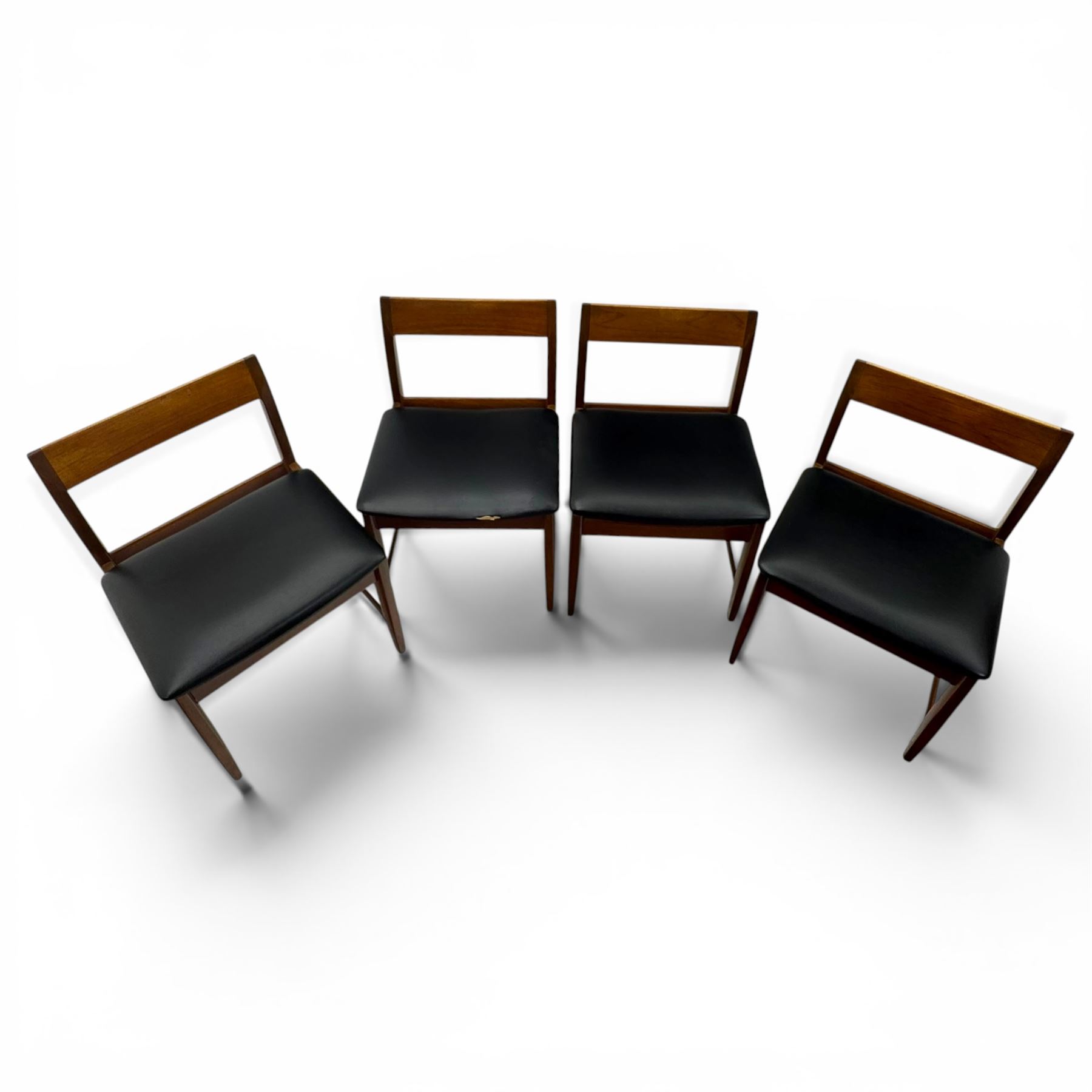 BCM (Bath Cabinet Makers) - mid-20th century teak extending dining table with BCM set of four teak dining chairs with bar back and black vinyl seats