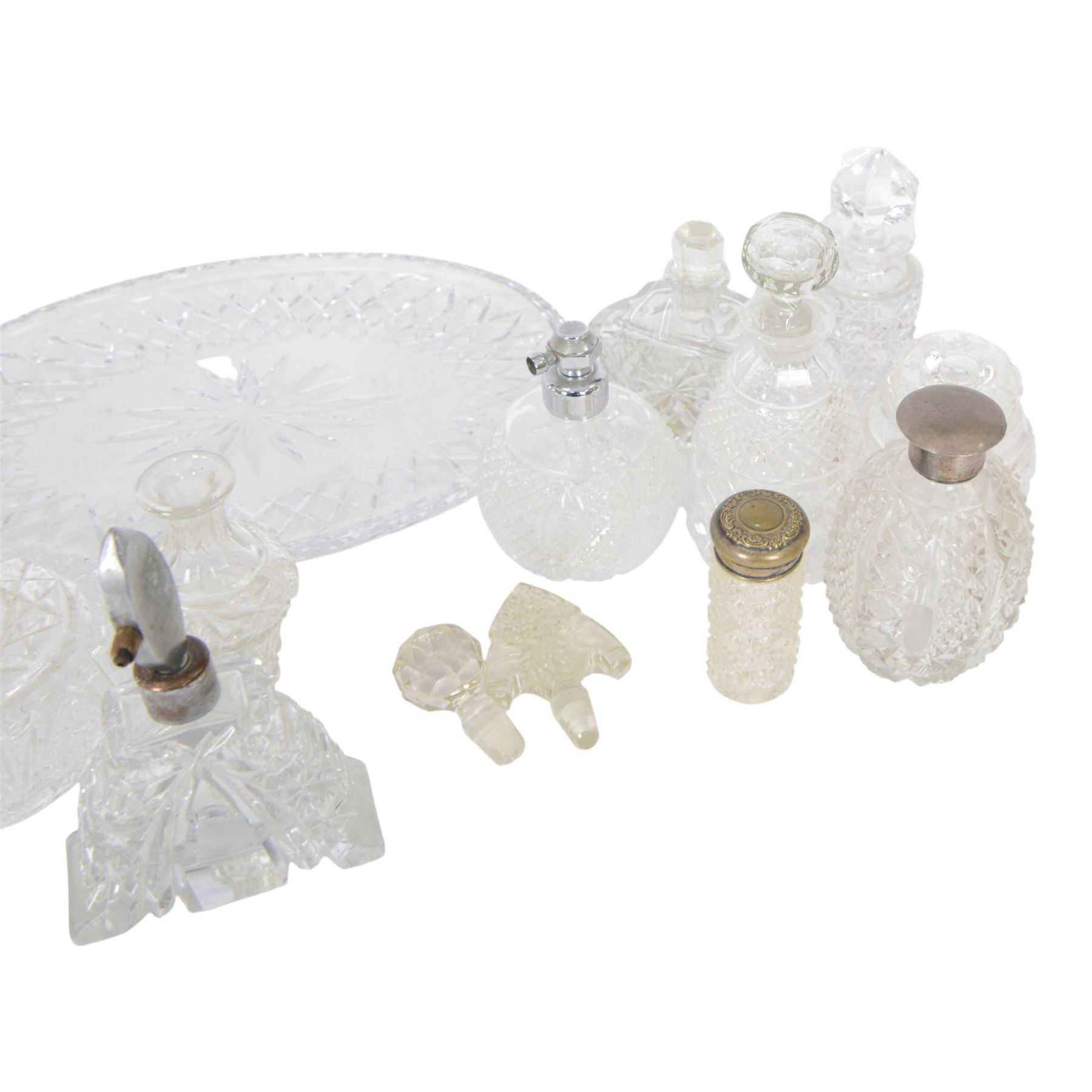 Collection of cut glass scent bottles including Art Deco examples and a cut glass tray