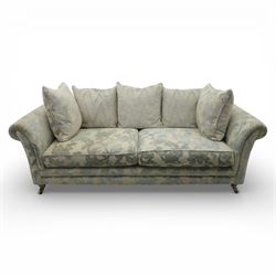 Alstons - 'Lowry' three seater settee, loose cushioned back and seat with additional cushions upholstered in silver and blue floral fabric, supported on square feet with chrome castors to the front