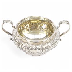 William IV silver twin handled sugar bowl, embossed with flowers and scrolling decoration with acanthus capped twin handles, hallmarked J Wrangham & William Moulson, London 1837, H10cm, D14cm