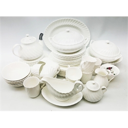  Wedgwood Candlelight pattern dinner service comprising ten dinner plates, six side and tea plates, six cups & saucers, cream jug, sugar bowl, sucrier, four mugs, gravy boat and stand, teapot, two tureens, oval platter, six bowls, two oval serving bowls & six matched napkin rings  