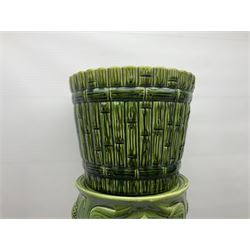 Jardiniere and stand, the jardiniere modelled as a pale, the stand with foliate and foliage decoration on a green ground, stand H73cm 