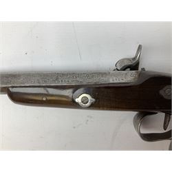 SECTION 1 FIREARMS CERTIFICATE REQUIRED OR REGISTERED FIREARMS DEALER - Pair of Reproduction Continental .44 calibre percussion target pistols, each with heavy 23.5cm octagonal to round barrel bearing various marks, crude scroll engraving to lock plate, hammer and octagonal section of barrel, unchequered walnut stock with brass butt plate and steel hooked trigger guard, numbered 8138 & 8164, L41.5cm overall; in maroon baize lined converted sapele mahogany fitted case bearing reproduction trade label for Trulock & Son Dublin containing small copper powder flask, steel scissor action bullet mould, nipple key, turned wooden mallet and lidded box, steel rammer and wooden cleaning rod, case L48cm
