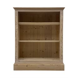 Contemporary light pine open bookcase, rectangular top with stepped moulded edge above a b...