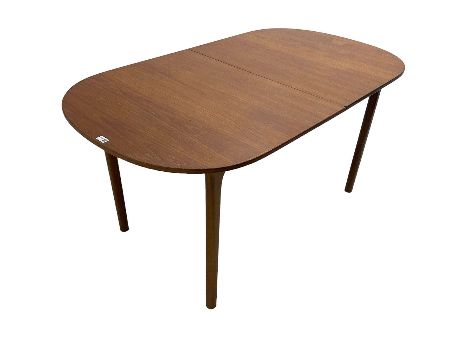 AH McIntosh & Co of Kirkaldy - mid-20th century teak extending dining table, rectangular top with rounded corners, concealed integrated double leaf, raised on tapered supports, 'Furniture by McIntosh sticker to underside of leaf