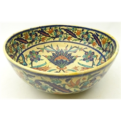  Iznik polychrome pottery bowl, decorated with tulips and other stylized flowers in underglaze blue with tones of green and red painted decoration, mark to underside, D32.5cm x H14cm   