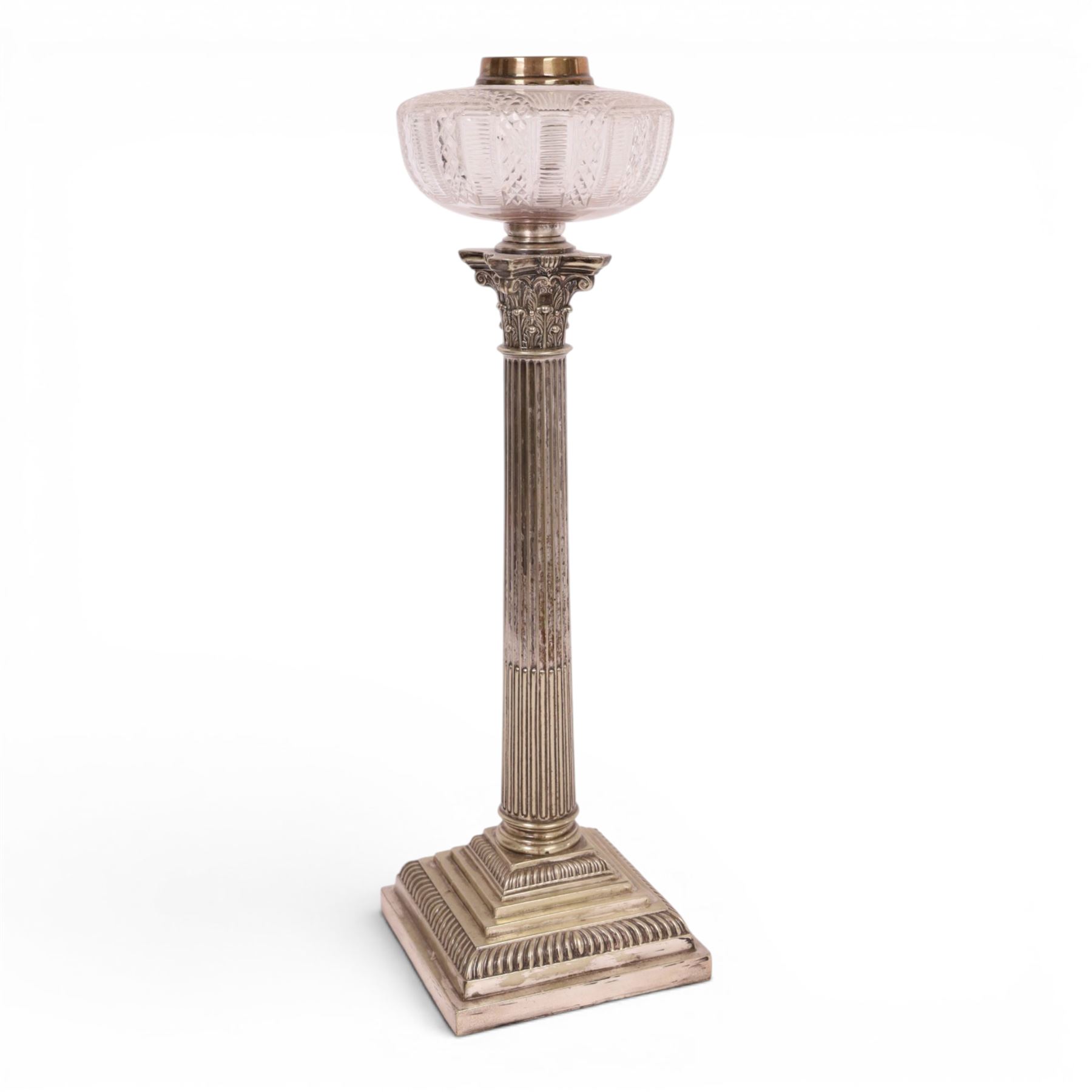 Victorian silver plated Corinthian column oil lamp, raised upon a stepped base, clear glass reservoir, H54cm 