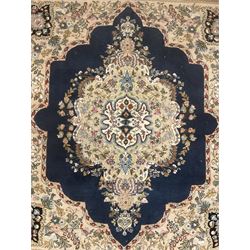 Persian Kirman indigo ground rug, central floral design medallion with matching spandrels, the guarded border decorated with stylised plant motifs 