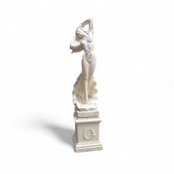 Cast stone garden statue, painted in a white finish on plinth