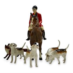 Beswick hunting group, comprising huntsman on bay horse no. 1501, fox figure no. 1440 , and four fox hounds, all with printed marks beneath (6)