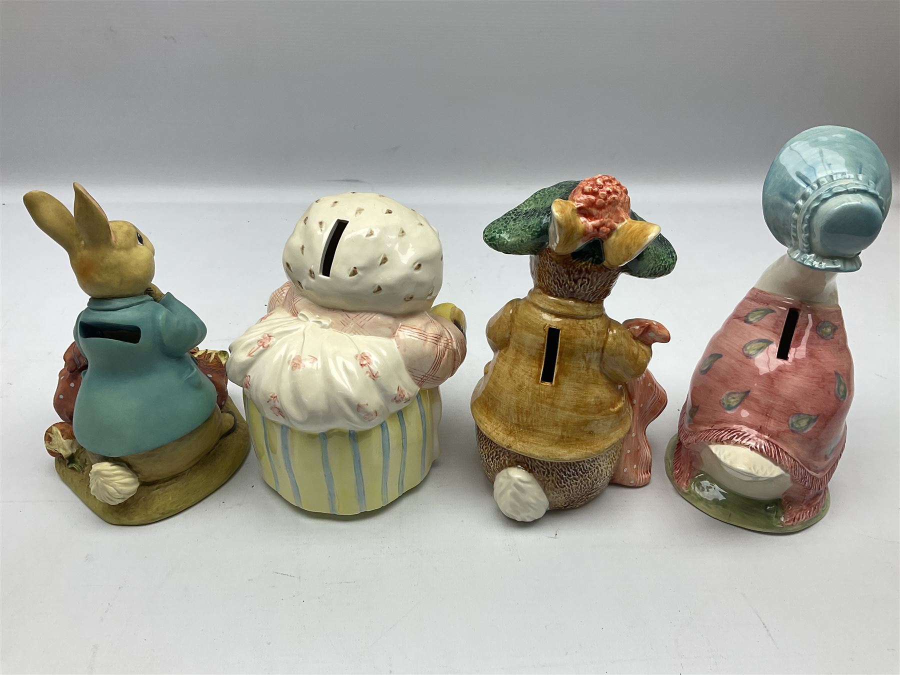 Nine Border Fine Arts and Enesco Beatrix Potter money boxes, to include Peter Rabbit, Benjamin Bunny, Mrs Tiggy-winkle, jemima puddle duck etc  