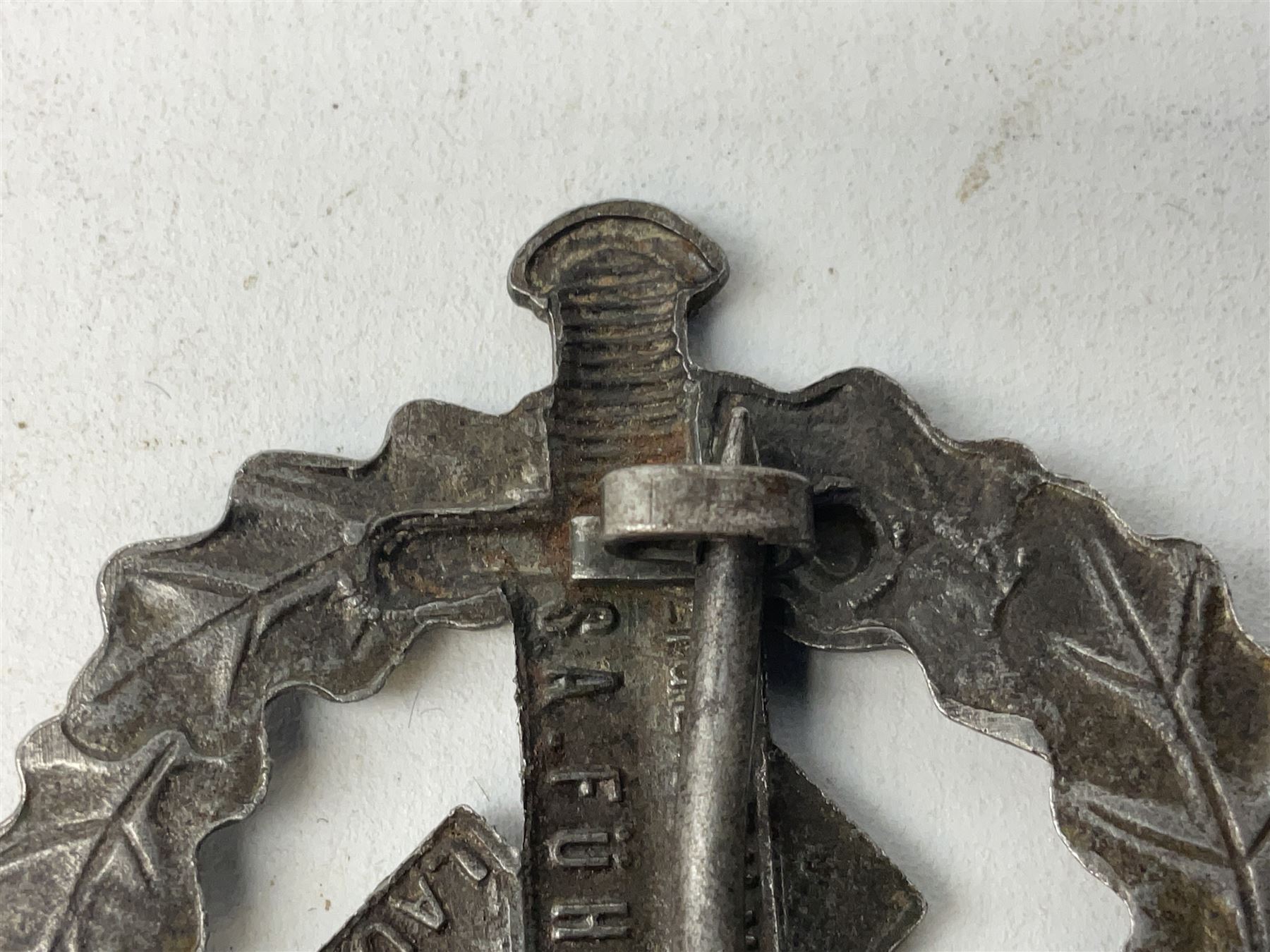 Two WW2 German Sports badges - SA sports badge marked verso 'W.Redo Eigentum D. Obersten SA. Fuhrung Saar Lautern'; and DRL sports badge marked verso 'Wernstein Jena D.R.G.M. 35269' (2)