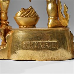Tibetan gilt bronze figure of Ekadashamukha Avalokiteshvara, standing upright on lotus base, his primary hands in anjali mudra, the other six radiating to the sides, H28cm; together with a gilt bronze figure of Ganesh or Ganapati, H26cm (2)