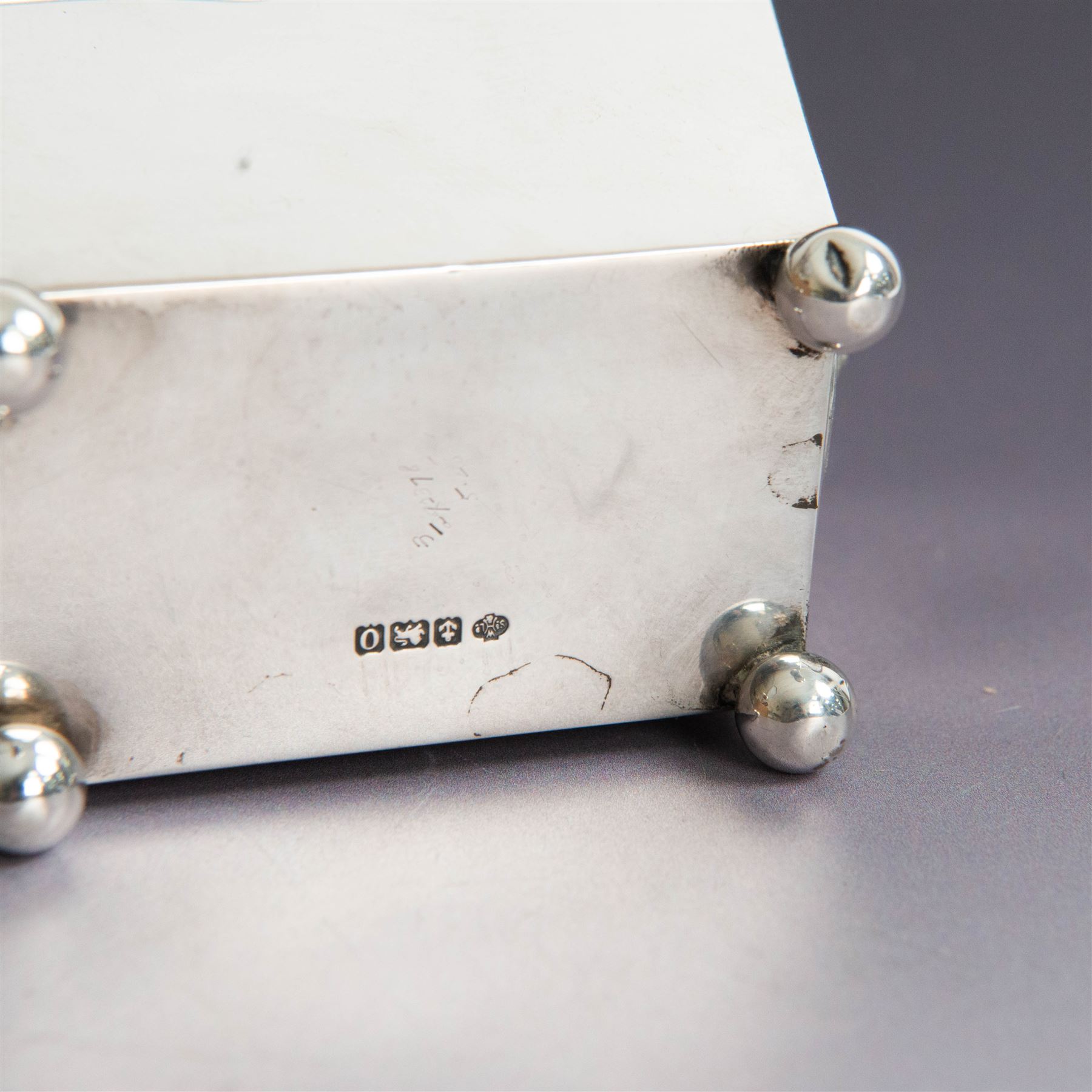 Early 20th century silver tea caddy, of sarcophagus form with twin lion mask mounted loop handles, upon four bun feet, hallmarked William Hutton & Sons Ltd, Birmingham 1913, H8cm, W9cm