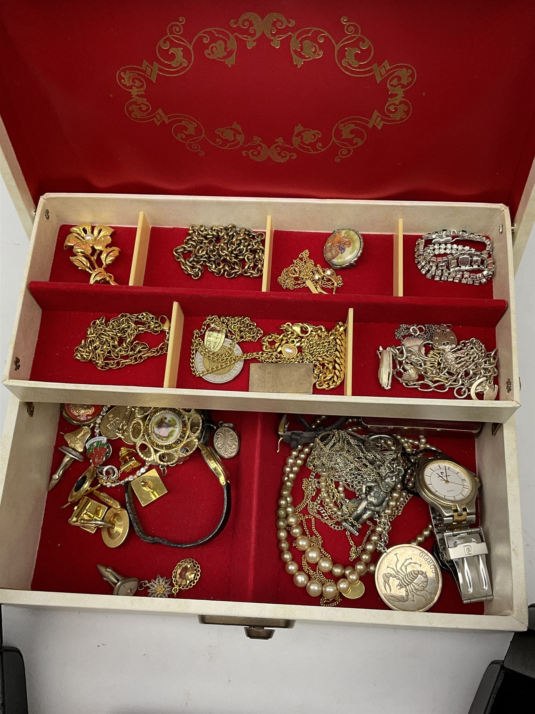 Two Klaus Kobec Entourage gentleman's and ladies, bicolour stainless steel quartz bracelet wristwatches, round white dials with Roman numerals and date apertures, both boxed, silver charm bracelet, silver jewellery and other costume jewellery