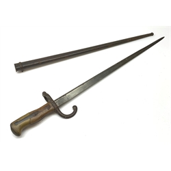 French Model 1874 Epee bayonet the 52cm steel blade inscribed 'Mre. d'Armes de St. Etienne Janvier 1880', in steel scabbard L66cm overall