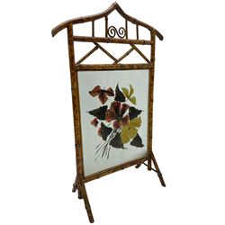 Victorian bamboo fire screen, pointed arched cresting rails over floral painted glass panel 