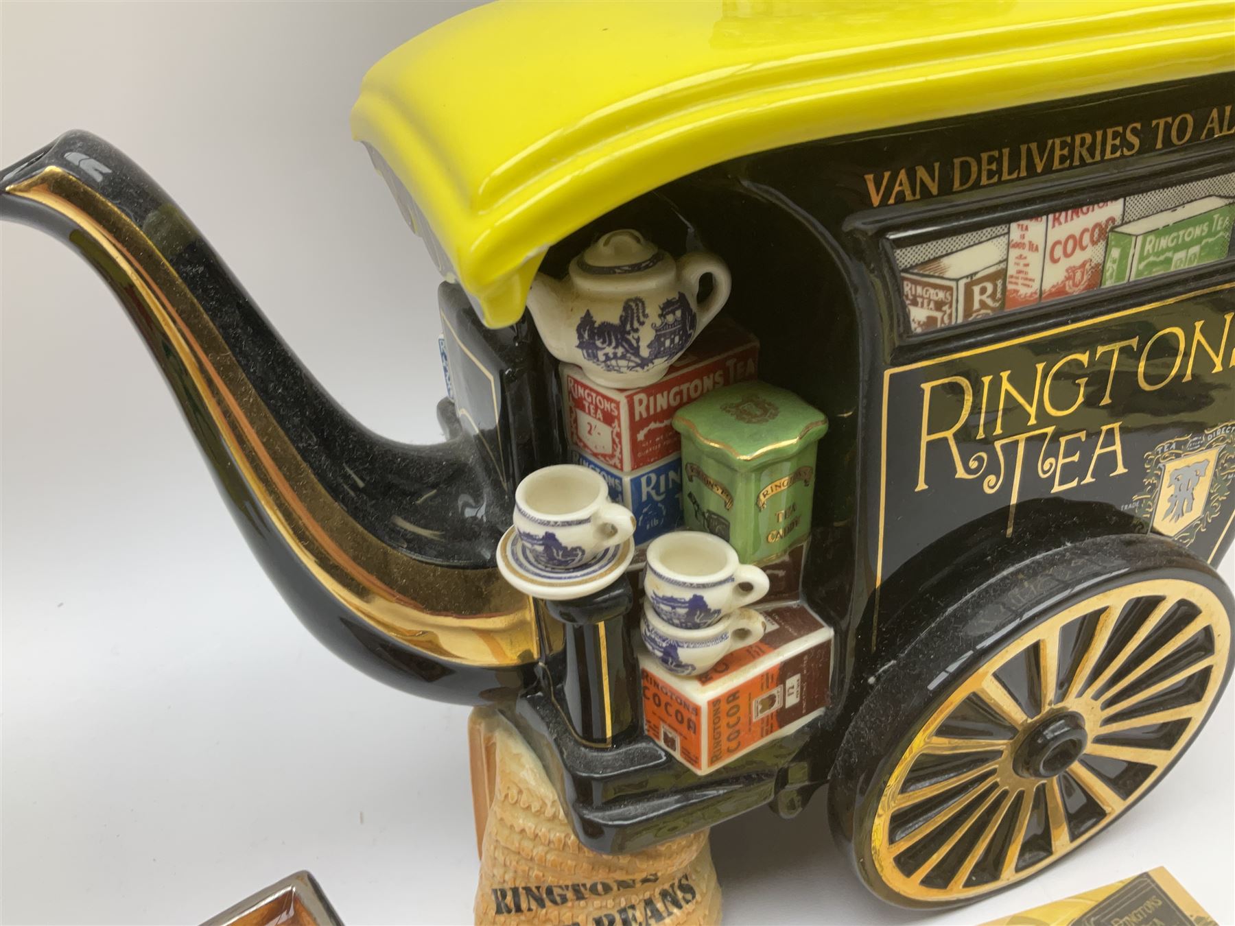 Ringtons novelty teapots, comprising the Ringtons Delivery Van teapot, and the Tea Merchant teapot, both with boxes and certificates of ownership.