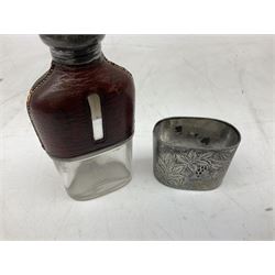 Cast metal nutcracker, in the form of a dog together with a pair of Swift Saratoga 8x40 binoculars in leather case and a hip flask, the glass flask covered in leather to the top with a detachable silver plated cup to base