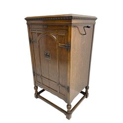 Early 20th century ‘HMV' 202 cabinet gramophone, oak cased, moulded top with foliate carved moulding hinges to reveal gramophone, two doors enclosing horn, on turned supports joined by moulded stretcher rails
