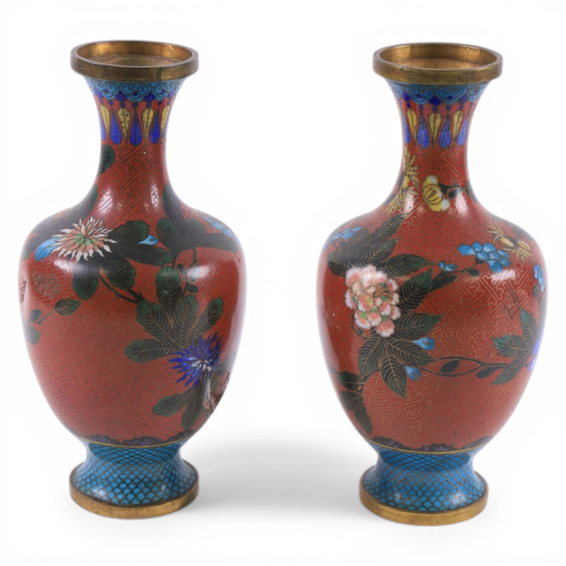 Pair of Chinese cloisonne vases, each of baluster form, decorated with blossoming peonies upon a red ground, H23.5cm