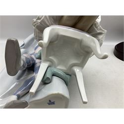 Lladro figure, Jester Serenade, modelled as a ballerina with bouquet of flowers seated before a jester playing the violin, limited edition 2541/3000, sculpted by Antonio Ramos, no 5932, with original box, year issued 1993, year retired 1994, H37cm