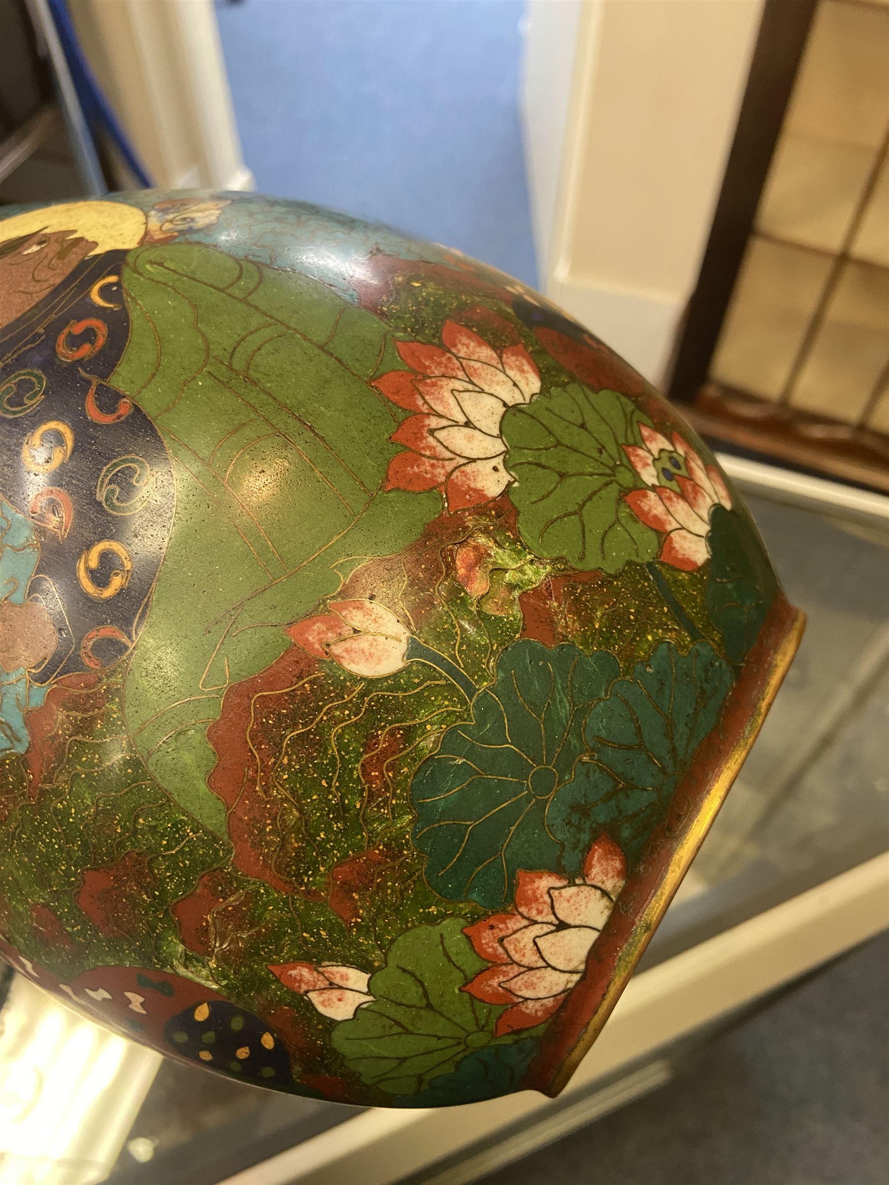 Japanese Cloisonne vase, Meiji/Taisho period, decorated with five haloed figures, possibly the Lucky Gods or Monks, in a landscape detailed with pine trees, lotus flowers and auspicious clouds, beneath a neck with band of fronds, with apocryphal Ming mark beneath, H31cm