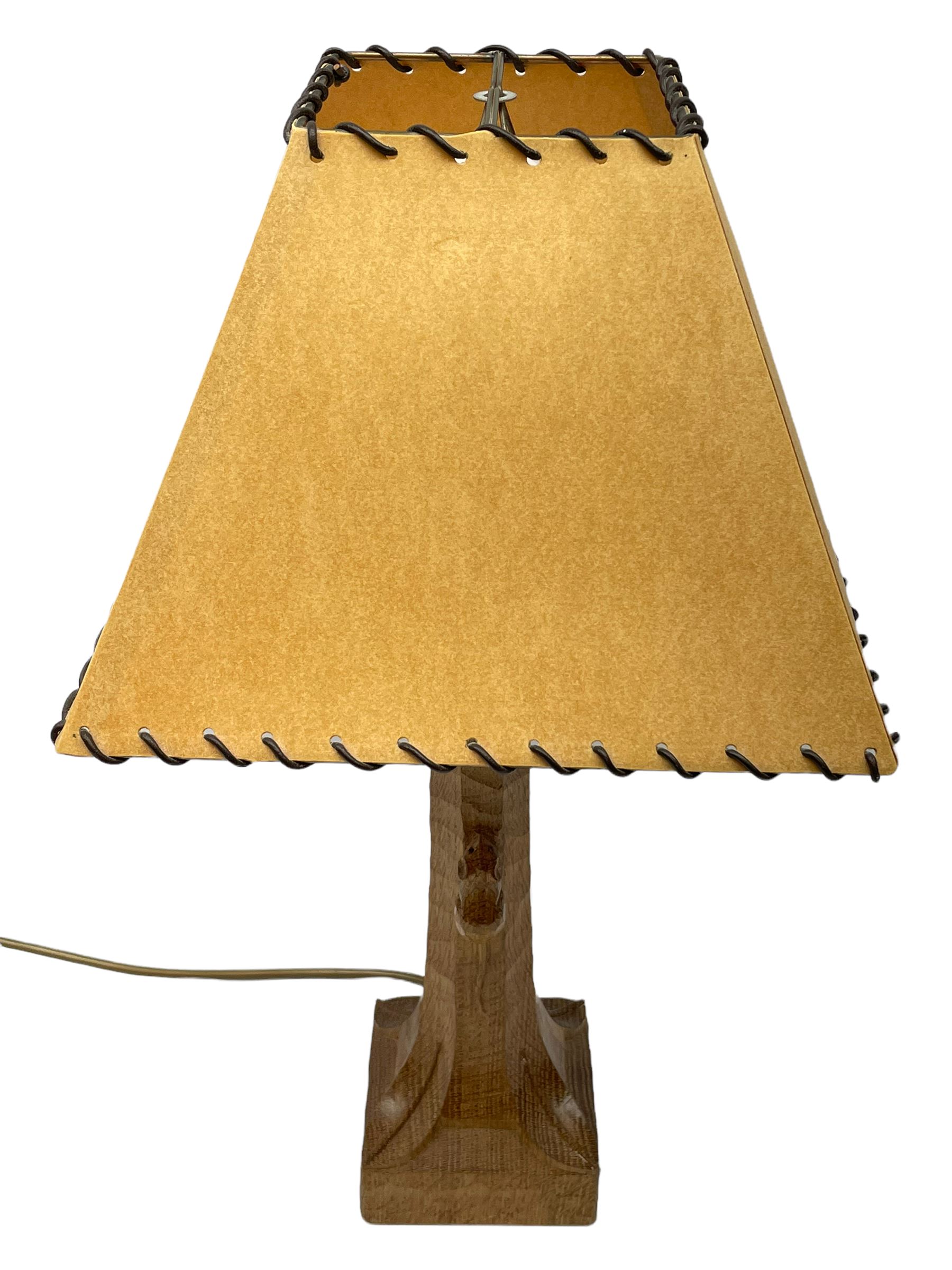 'Mouseman' tooled oak table lamp, the octagonal tapered stem carved with mouse signature, with shade, by Robert Thompson of Kilburn