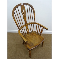 19th century elm and ash high back Windsor armchair, pierced splat and stick back, turned supports with H stretcher, W54cm  