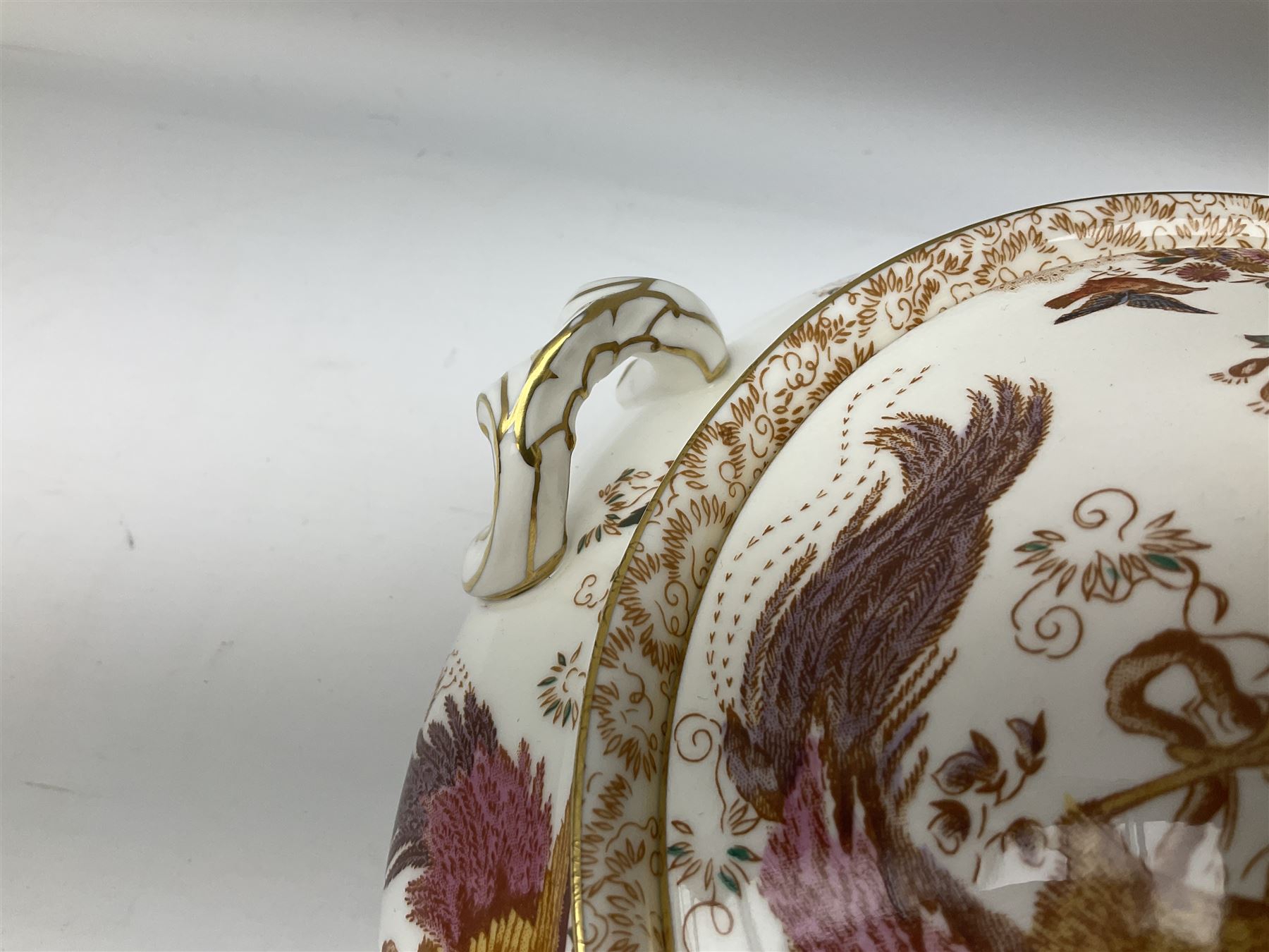 Royal Crown Derby Olde Avesbury pattern dinner and coffee service for six place settings, decorated with exotic birds amidst blossoming branches, comprising six dinner plates, six dessert plates, two tureen and covers, sauce boat and stand, oval serving platter, coffee pot, six coffee cans and six saucers, cream jug, and open sucrier, each with printed mark beneath
