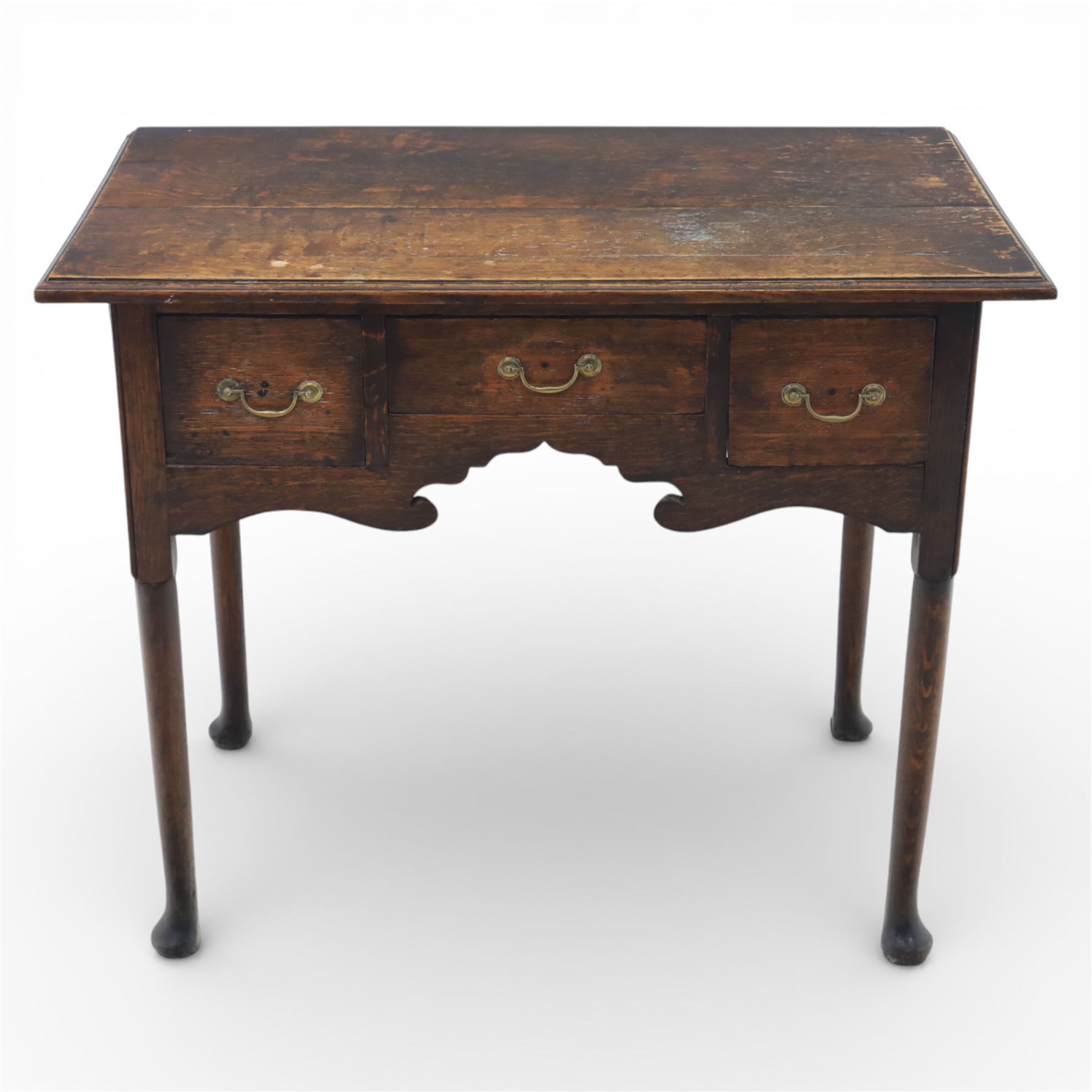 Georgian oak lowboy, the rectangular top with moulded edge over three fitted drawers and shaped apron, raised upon slender cabriole legs, with pad feet