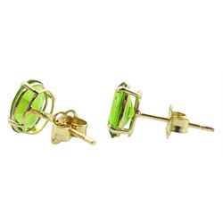 Pair of 9ct gold oval green stone stud earrings, stamped 9K